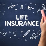 Hand drawing  LIFE INSURANCE inscription with white chalk on blackboard, medical concept